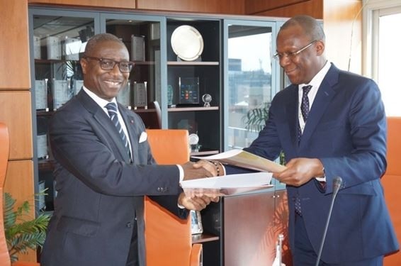 Afreximbank president Jean-Louis Ekra (left) signs MOU with ICCO executive director Jean-Marc Anga