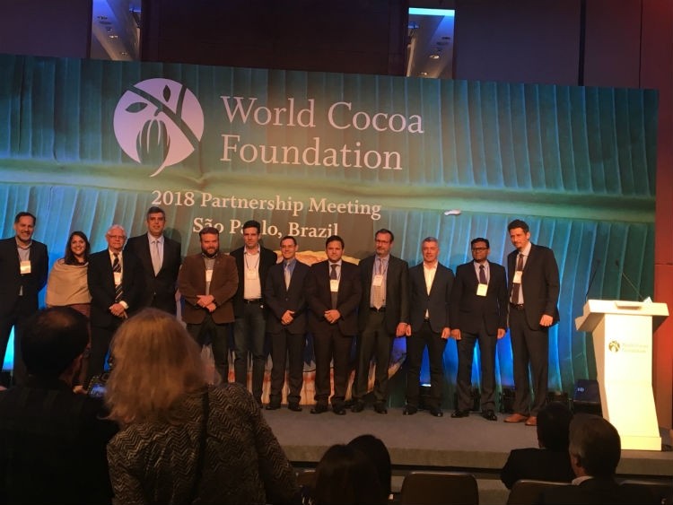 Members from Cocoa Action Brasil companies join Pedro Ronca on stage at the WCF conference in Sao Paulo to make the announcement. Photo: Anthony Myers