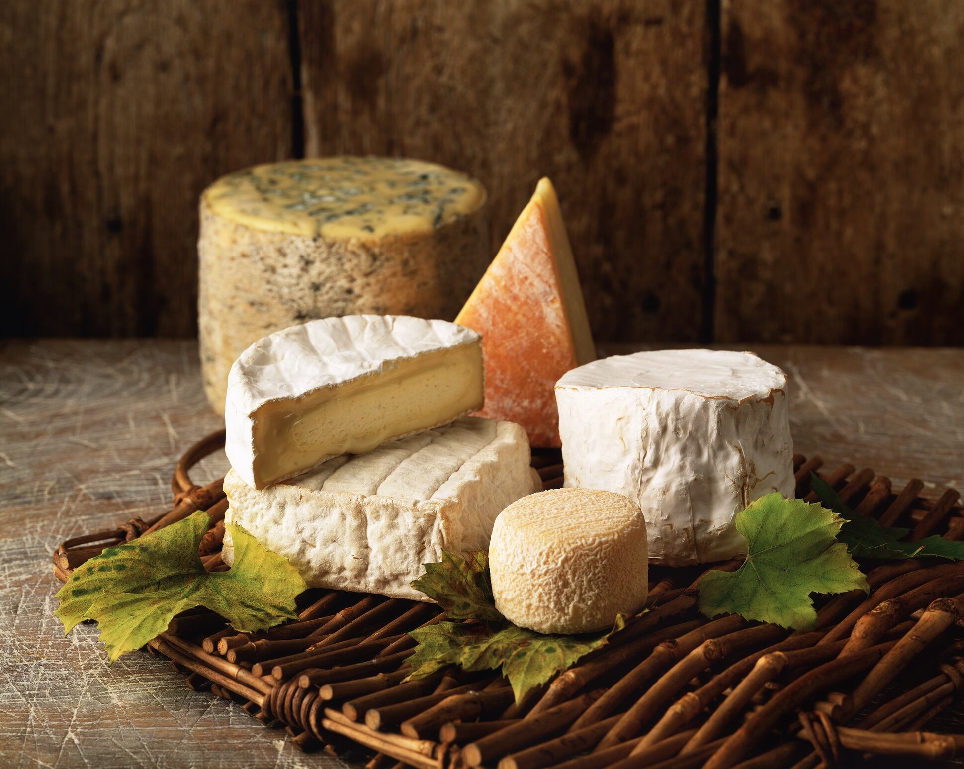 Cheese board with a variety of hard and soft cheeses on
