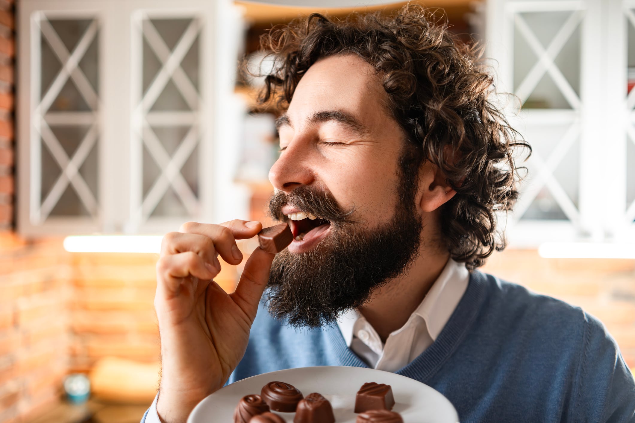 Young Handsome Man Enjoying Sweet Treats.