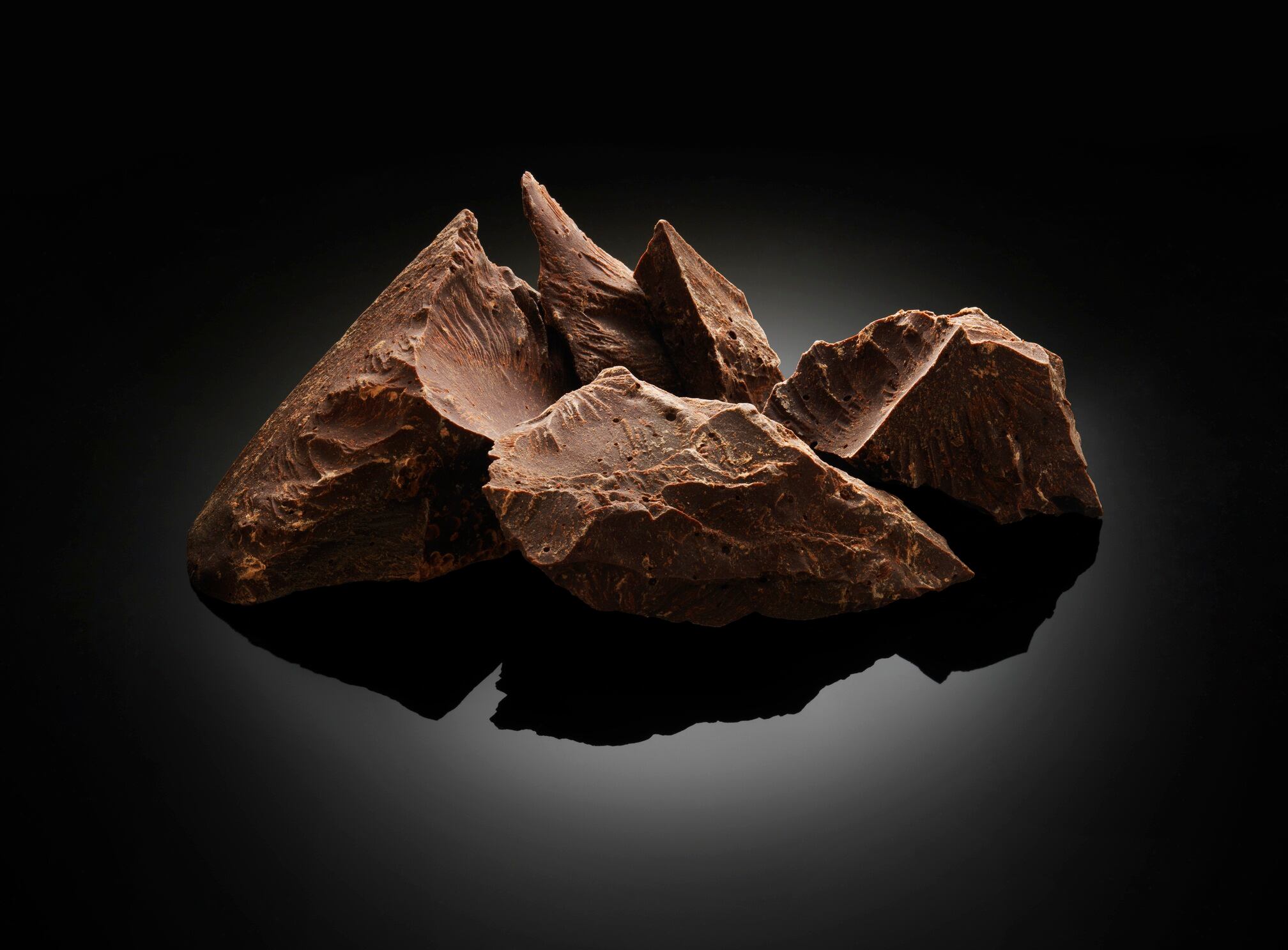 Chocolate blocks on black background.
