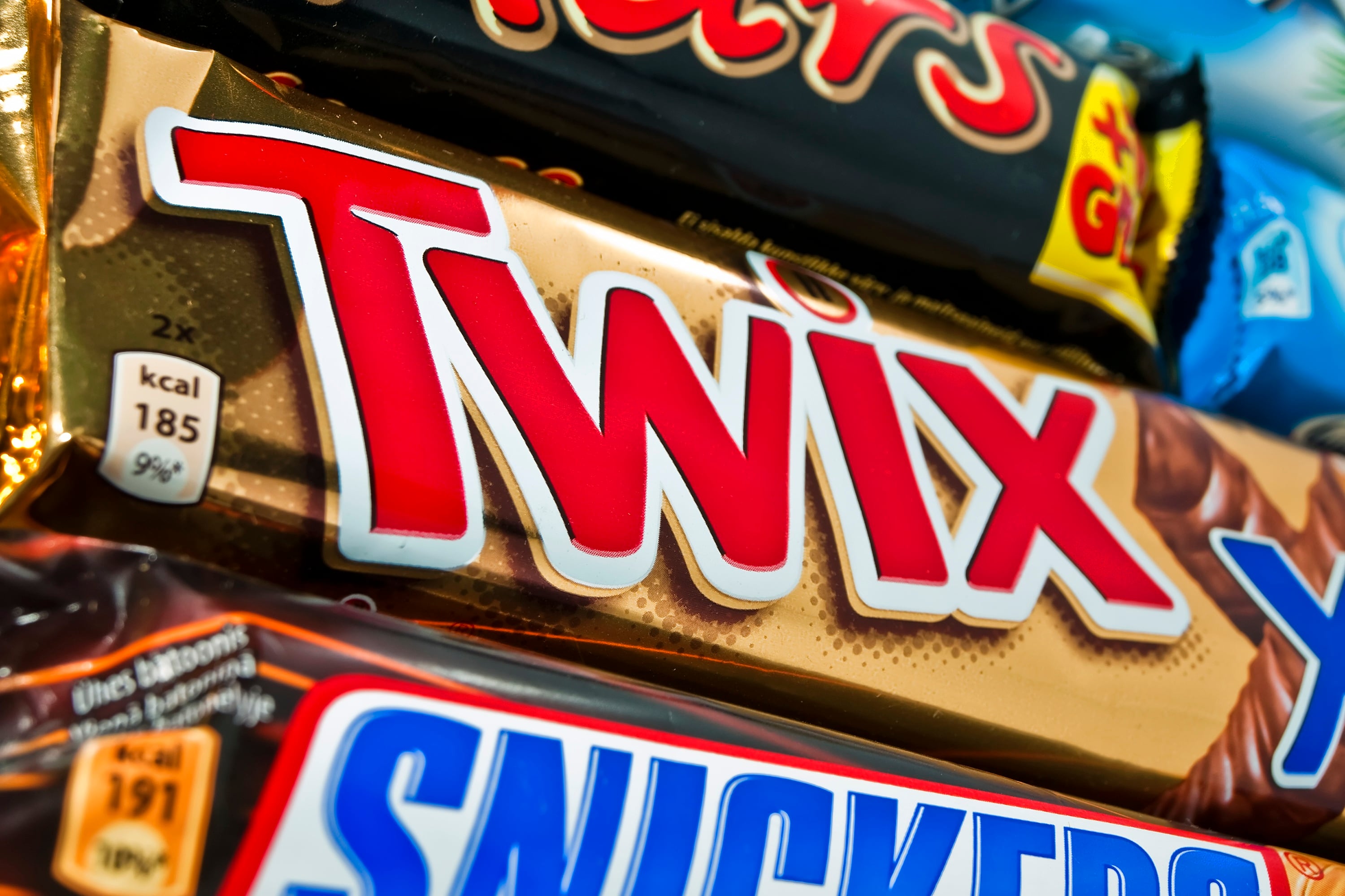 Close up of Twix, Snickers and Mars chocolate bars.