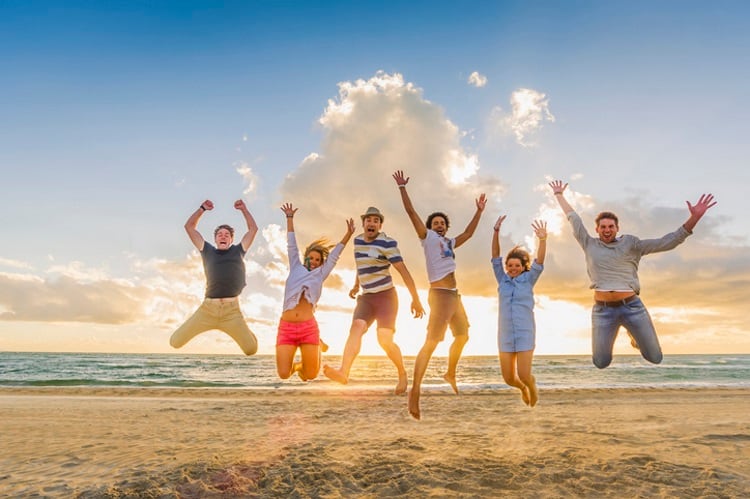 Jumping on the beach Getty