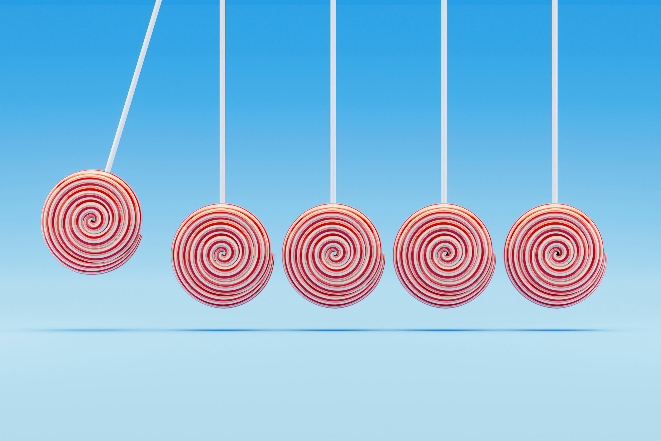 A digitally generated image featuring a Newton’s Cradle where the traditional spheres are replaced with colorful lollipops, symbolizing teamwork, leadership, and the sweet impact of collaboration. This creative and playful design blends the principles of physics with positive group dynamics, making it ideal for business, motivation, and team-building themed visuals.