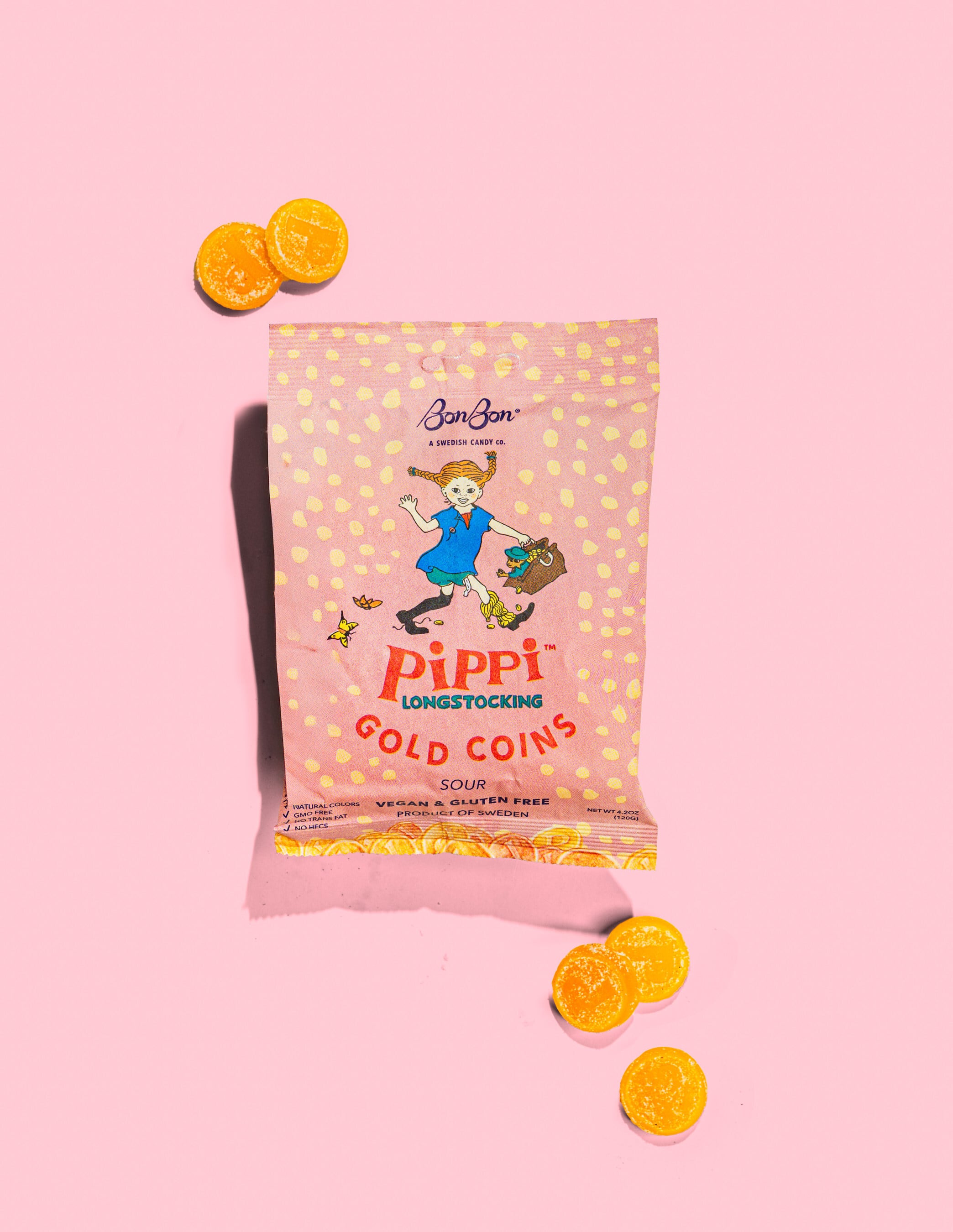A packshot of BonBon Swedish Candy C's Pippi Longstocking-inspired sour candy against a pink background.