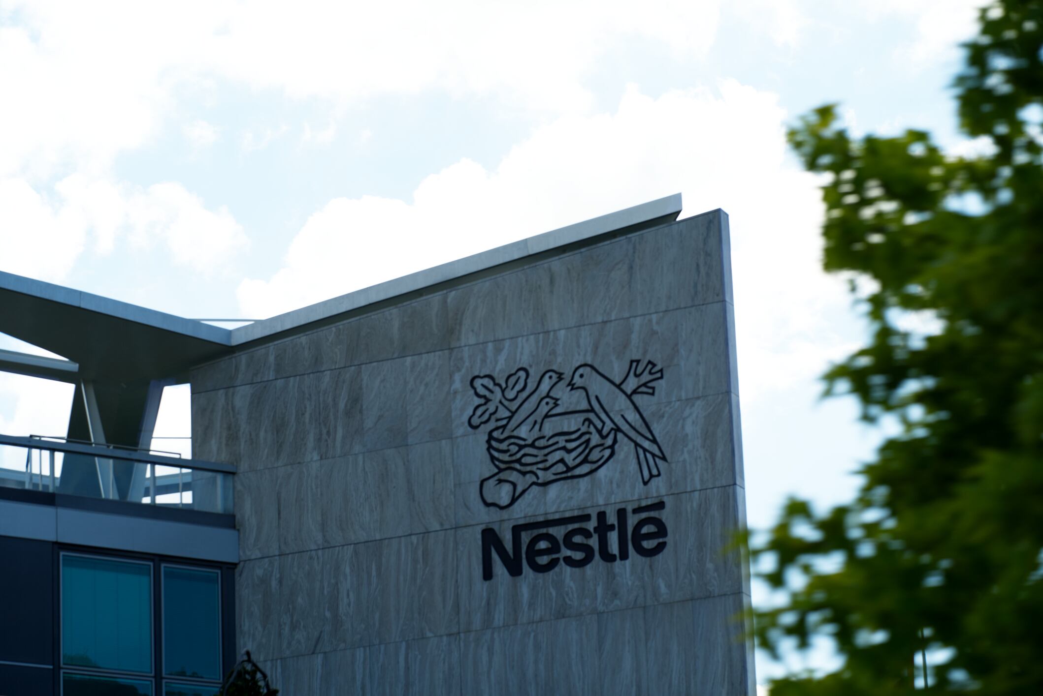Loge of food company Nestlé at headquarters at City of Vevey on a cloudy summer day. Photo taken August 28th, 2021, Vevey, Switzerland.