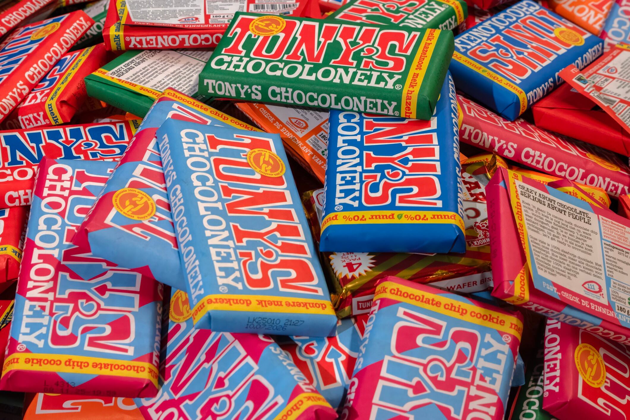 Pile of Tony's Chocolonely chocolate bars.