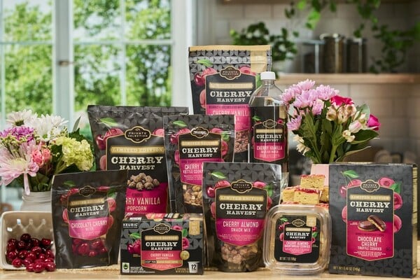 Still life of the 17 items in Kroger's limited-edition Cherry Harvest line in a kitchen setting.