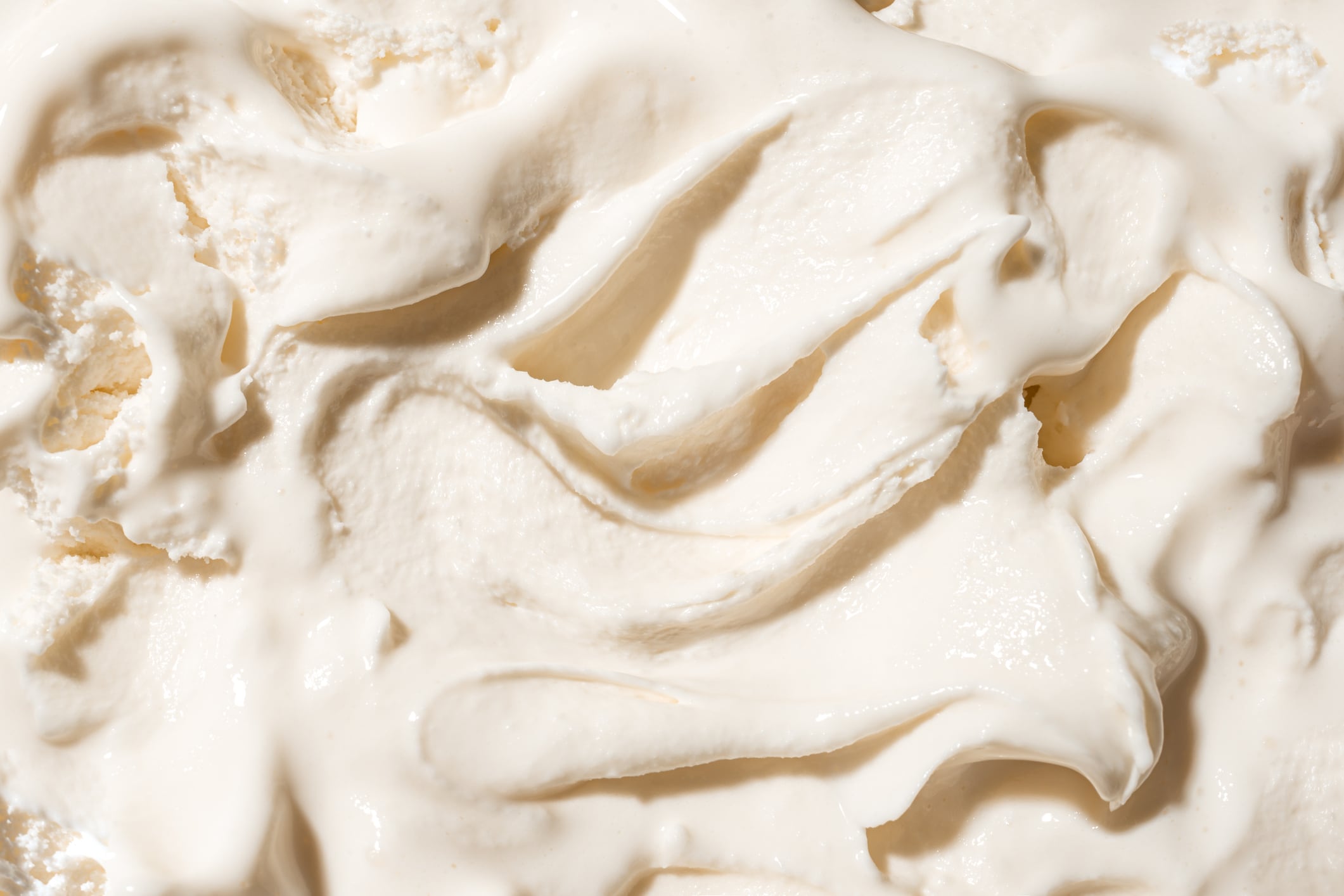 White vanilla ice cream texture close up.  Homemade fresh frozen yogurt ice cream, italian gelato.