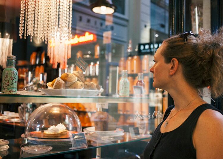 Woman-looking-at-bakery-through-a-shop-window-Gary-Yeowell.jpg