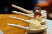 Chocolate in white spoons for testing wine - GettyImages-pulpitis