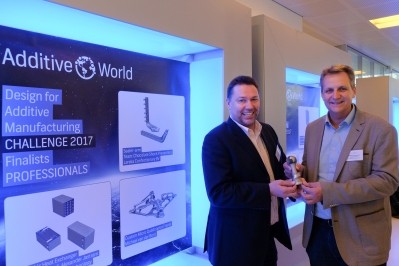 Jan-Willem van der Voort, (right) Lareka Confectionery Equipment collects the award for Design Challenge 2017. Picture: Additive Industries.