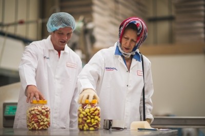 The Princess Royal inspects a sweet jar with The Candy Makers' MD Robert Whittleston