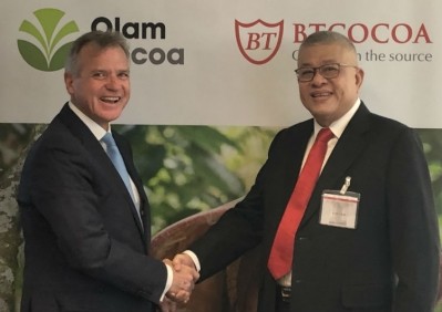 Gerard A Manley, CEO of Olam Cocoa and Piter Jasman, founder of BT Cocoa, sign the acquisition deal. Pic: Olam Cocoa