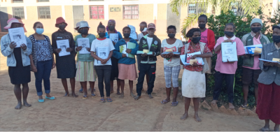 Cocoa farmers in Madagascar receive their literacy certificates. Pic: MIA