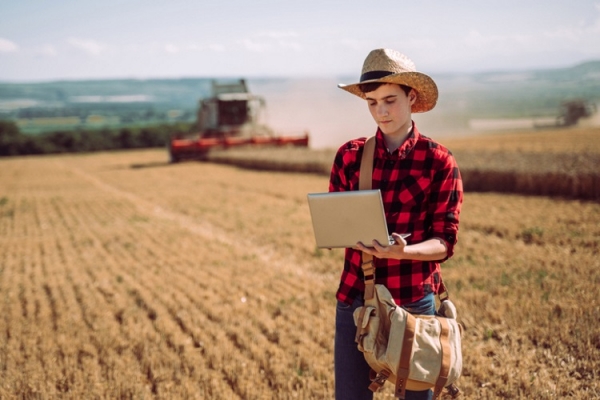 Young farmer with laptop YorVen