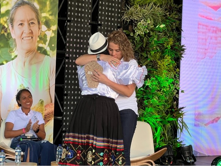 Alejandra Sarasty, Chocolate Cordillera's Chief Global B2B Officer, embraces one of the women cocoa farmers from the ATENEA programme. Pic: CN