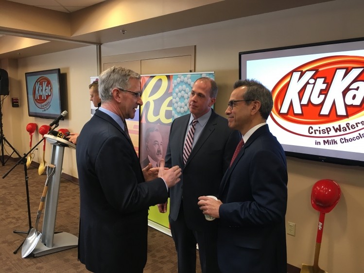 Pennsylvania Secretary of Agricultural Russell Redding (left) talks with plant manager Stephen Knight (center) and Rick Camacho, chief supply chain officer, at the groundbreaking event for a new KitKat production line. Photo: Hershey