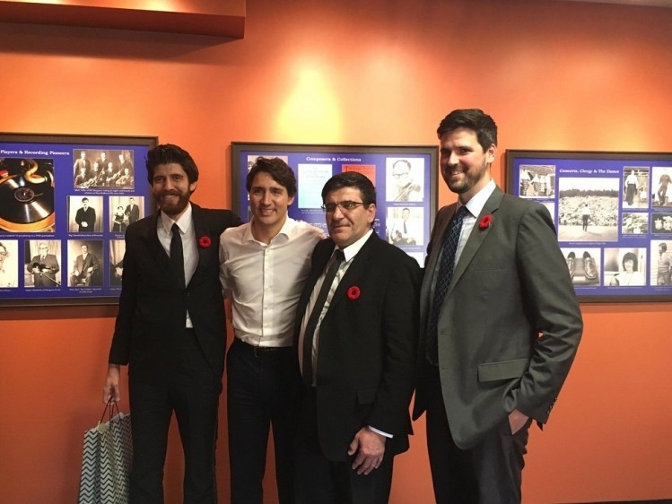 Tareq Hadhad (far left) met with Canada's Prime Minister Justin Trudeau.  Pic: Peace By Chocolate