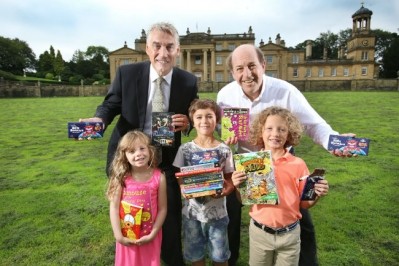 William Whitaker, managing director of Whitakers Chocolates, and Trevor Wilson from the Broughton Hall Children's Literature Festival with young book lovers