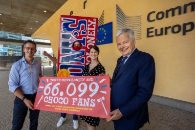 Paul Schoenmakers from Tony's Chocolonely And Lara Wolters deliver the petition to  Didier Reynders, EU Commissioner For Justice. Pic: Tony's Chocolonely